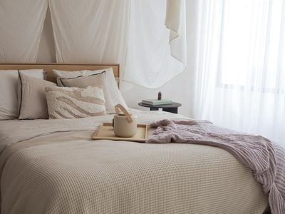 Sunlight streaming through soft white curtains